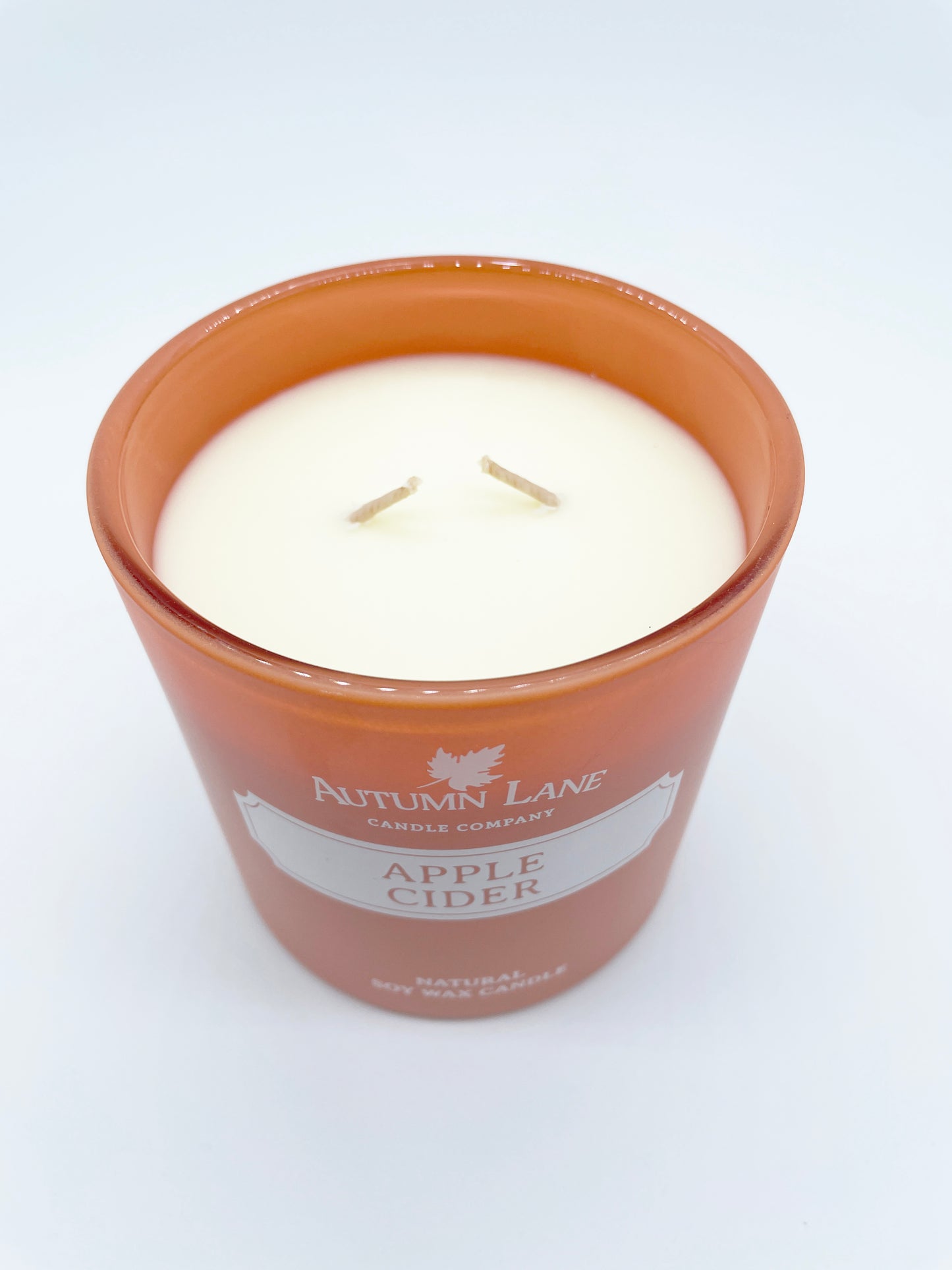 scented candle with fragrance of apple cider